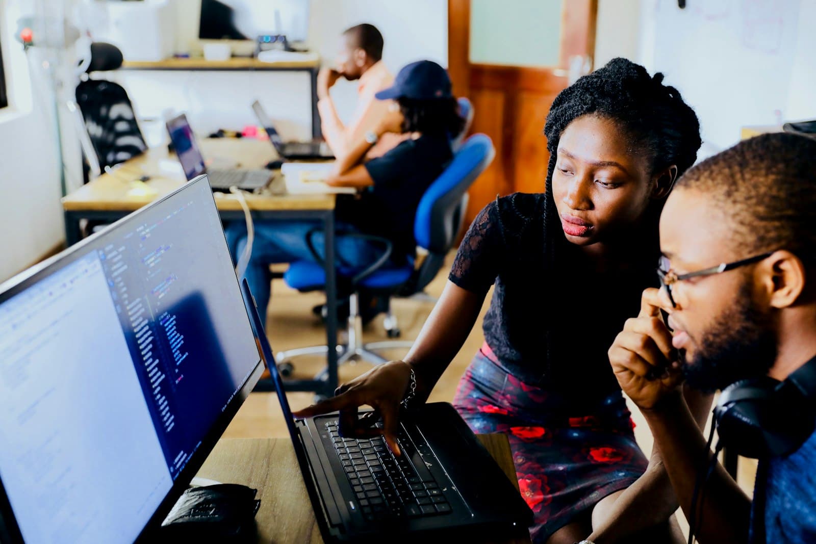 Diverse group of people using various devices to interact with digital forms
